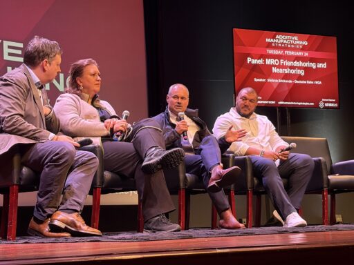 Panel discussion on the future of additive manufacturing and industry trends at an AM conference